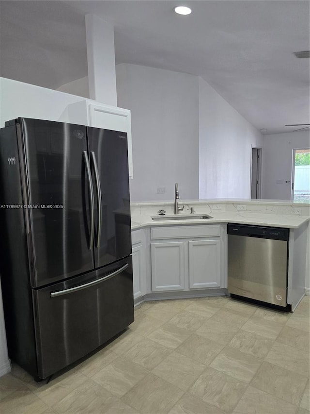 453 Dahoon Holly Dr, Daytona Beach, FL 32117 - kitchen with freestanding refrigerator, dishwasher, a sink, light stone counters, and white cabinetry