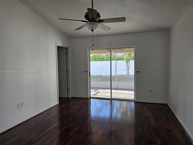 453 Dahoon Holly Dr, Daytona Beach, FL 32117 - empty room featuring a ceiling fan, dark wood finished floors, and baseboards