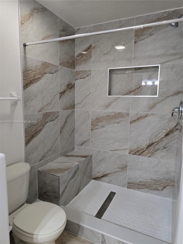 453 Dahoon Holly Dr, Daytona Beach, FL 32117 - bathroom with toilet and a tile shower
