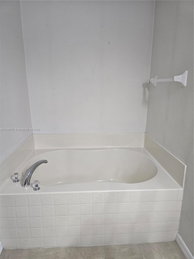453 Dahoon Holly Dr, Daytona Beach, FL 32117 - full bath featuring a garden tub and tile patterned flooring