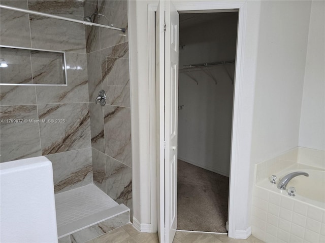 453 Dahoon Holly Dr, Daytona Beach, FL 32117 - full bathroom with a stall shower, a garden tub, and a spacious closet