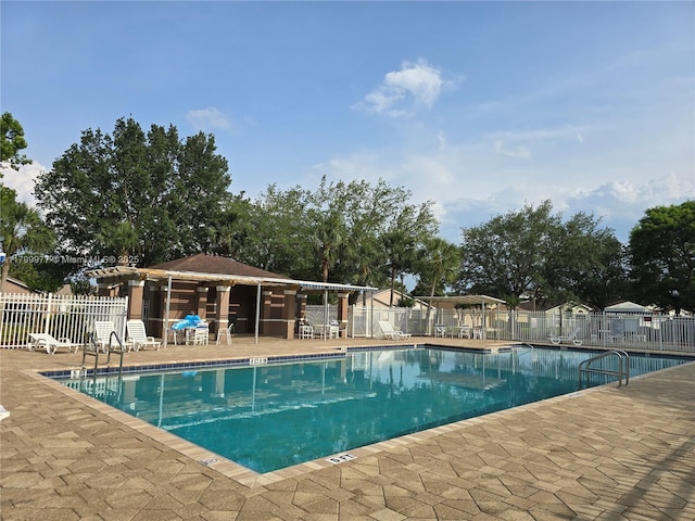 453 Dahoon Holly Dr, Daytona Beach, FL 32117 - community pool featuring fence and a patio