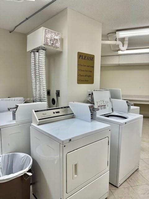 10777 W Sample Rd Unit 610, Coral Springs, FL 33065 - shared laundry featuring independent washer and dryer and light tile patterned floors