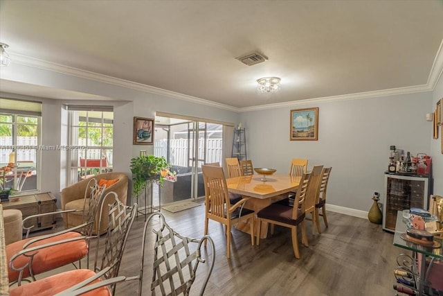 13392 NW 7th St, Plantation, FL 33325 - dining space with crown molding, wood finished floors, and baseboards