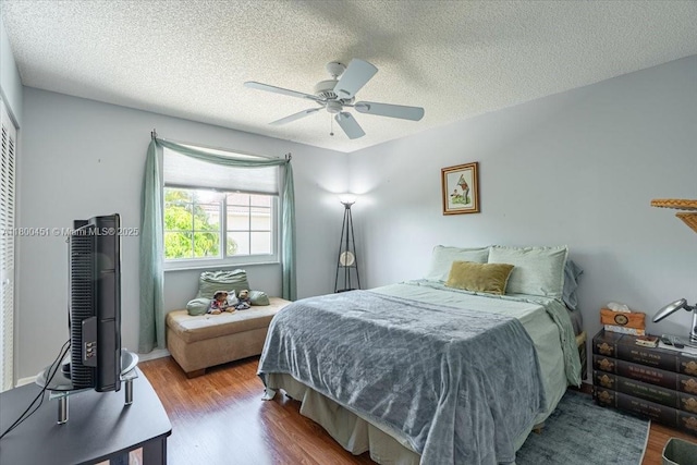 13392 NW 7th St, Plantation, FL 33325 - bedroom featuring wood finished floors, a textured ceiling, and ceiling fan