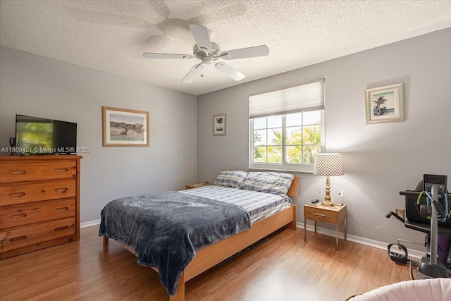 13392 NW 7th St, Plantation, FL 33325 - bedroom with wood finished floors, baseboards, a textured ceiling, and ceiling fan