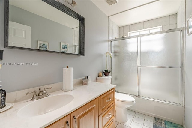 13392 NW 7th St, Plantation, FL 33325 - full bath with vanity, shower / bath combination with glass door, tile patterned flooring, and toilet