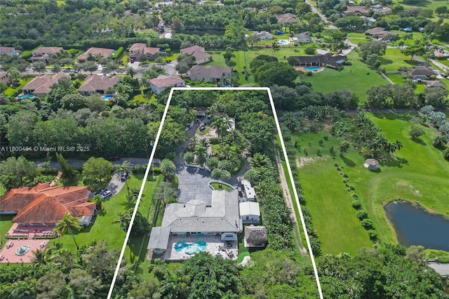 aerial view of residential area featuring property boundaries highlighted and a large body of water