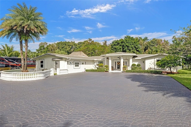 view of front of house featuring stucco siding