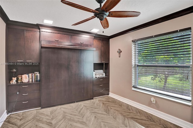 unfurnished bedroom featuring baseboards, crown molding, and ceiling fan