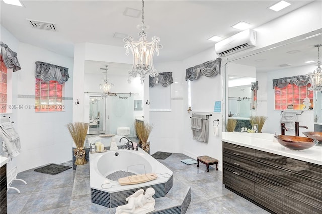 bathroom featuring a chandelier, a wall mounted air conditioner, and a bath