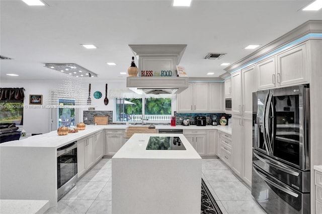 kitchen with smart refrigerator, a peninsula, black electric cooktop, light countertops, and recessed lighting