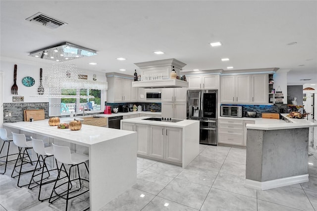 kitchen featuring a peninsula, black appliances, open shelves, decorative backsplash, and recessed lighting