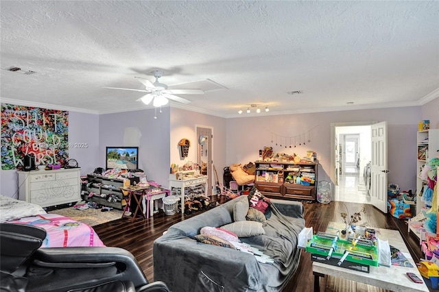 bedroom with wood finished floors, crown molding, ceiling fan, and a textured ceiling