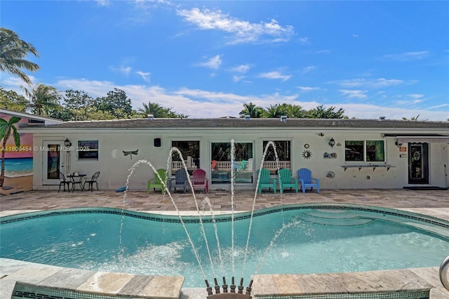 outdoor pool featuring a patio