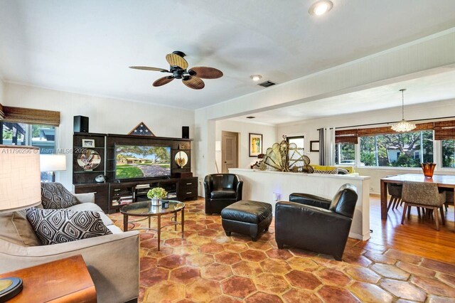 825 NE 98th St, Miami Shores, FL 33138 - living room with ceiling fan, recessed lighting, and ornamental molding