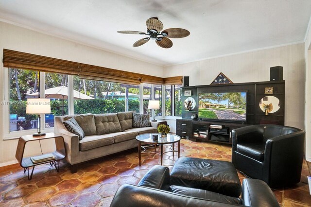 825 NE 98th St, Miami Shores, FL 33138 - living area with crown molding, healthy amount of natural light, and a ceiling fan