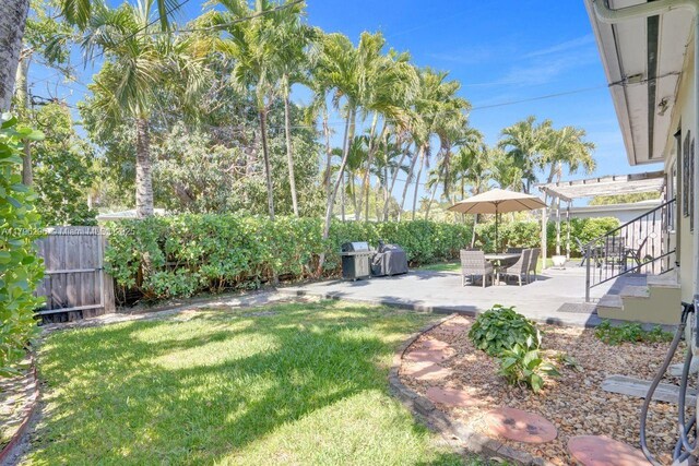 825 NE 98th St, Miami Shores, FL 33138 - view of yard with a patio and stairs