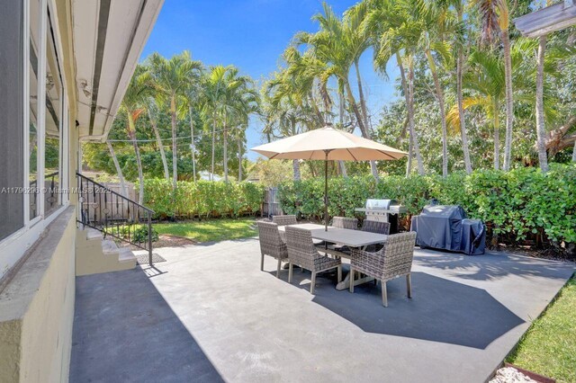 825 NE 98th St, Miami Shores, FL 33138 - view of patio with outdoor dining area and a grill