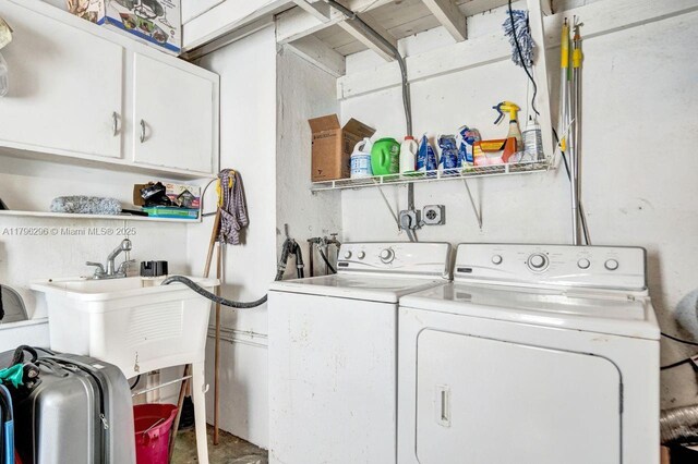 825 NE 98th St, Miami Shores, FL 33138 - clothes washing area featuring cabinet space and washer and dryer