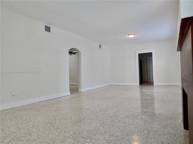 1436 SW 3rd St, Miami, FL 33135 - unfurnished room featuring speckle patterned floor and arched walkways
