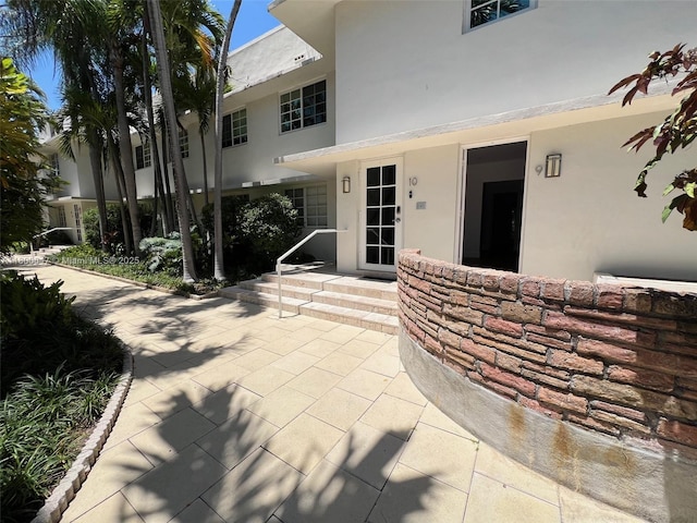 1605 Lenox Ave Unit 1605-9, Miami Beach, FL 33139 - view of exterior entry featuring stucco siding