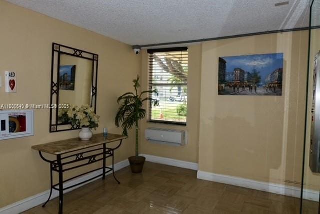 3801 Environ Blvd Unit 516, Lauderhill, FL 33319 - hallway with a textured ceiling and baseboards