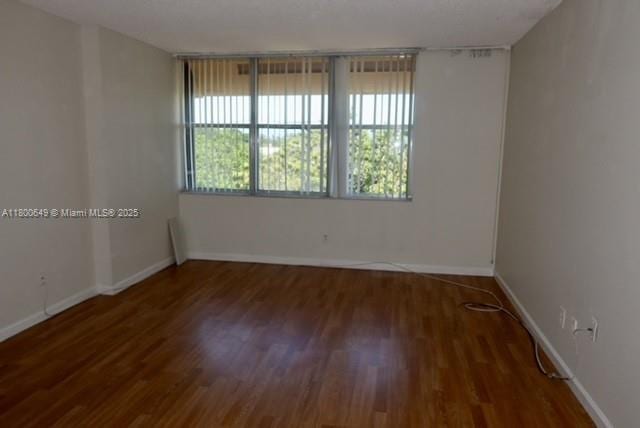 3801 Environ Blvd Unit 516, Lauderhill, FL 33319 - empty room featuring wood finished floors and baseboards