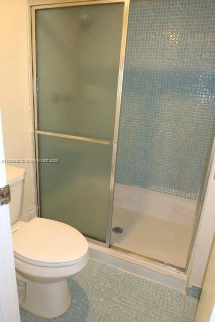 3801 Environ Blvd Unit 516, Lauderhill, FL 33319 - bathroom featuring a shower stall and toilet
