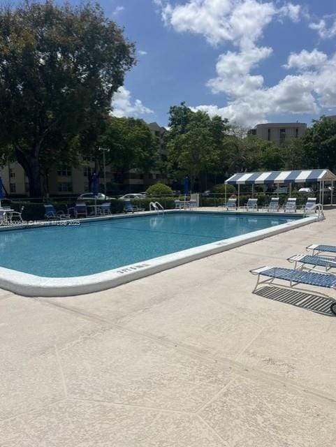 3801 Environ Blvd Unit 516, Lauderhill, FL 33319 - community pool featuring a patio area