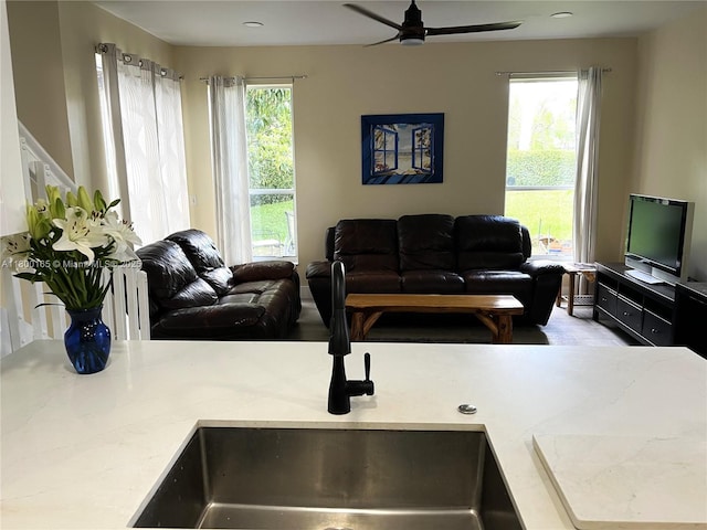 living room featuring a ceiling fan