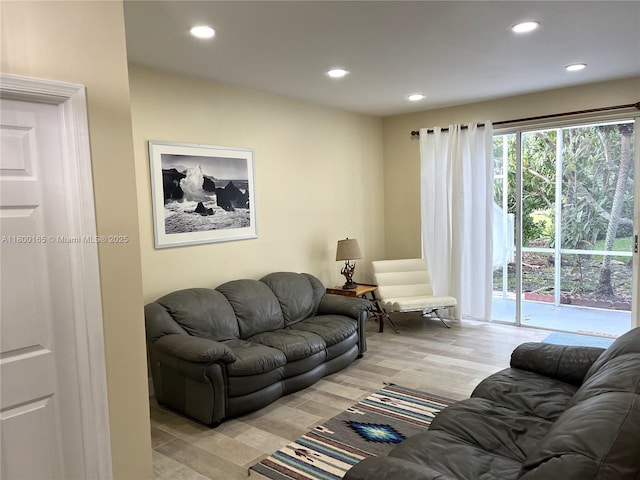 living area featuring recessed lighting and light wood-style flooring
