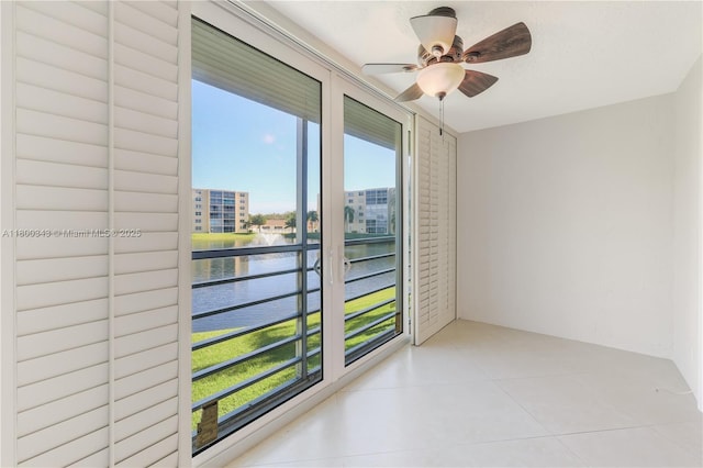 431 SE 3rd St Unit 201, Dania Beach, FL 33004 - unfurnished room with a water view, light tile patterned floors, and a ceiling fan