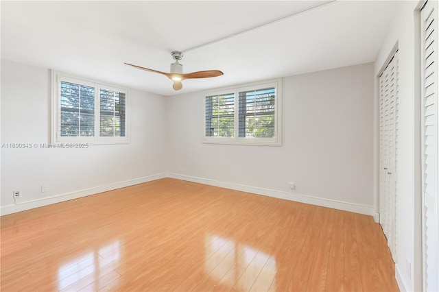 431 SE 3rd St Unit 201, Dania Beach, FL 33004 - unfurnished bedroom with light wood-style flooring, baseboards, and ceiling fan