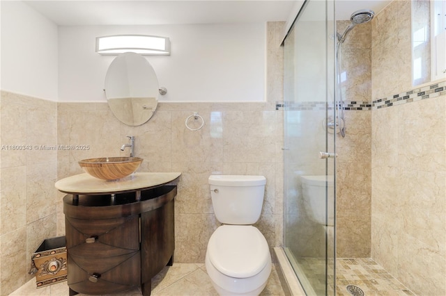 431 SE 3rd St Unit 201, Dania Beach, FL 33004 - bathroom featuring tile walls, a shower stall, toilet, vanity, and plenty of natural light
