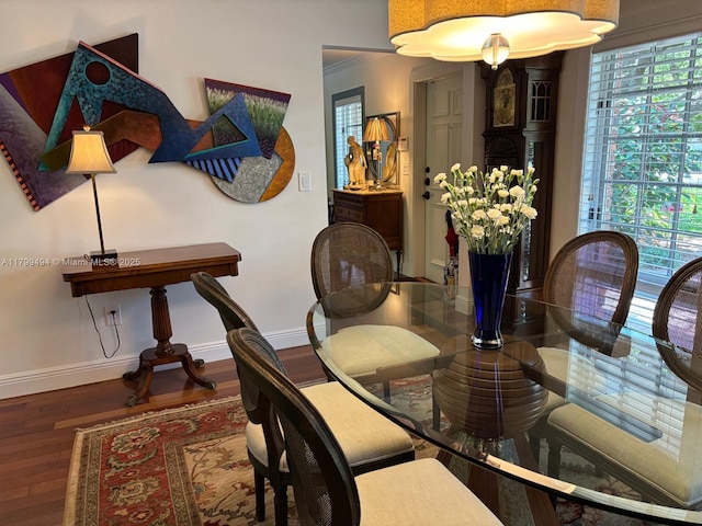 dining room with wood finished floors and baseboards