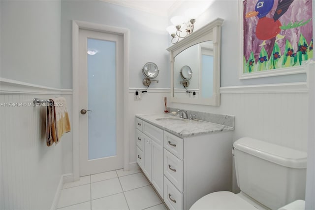 8345 SW 143rd St, Palmetto Bay, FL 33158 - bathroom featuring vanity, tile patterned floors, and a wainscoted wall