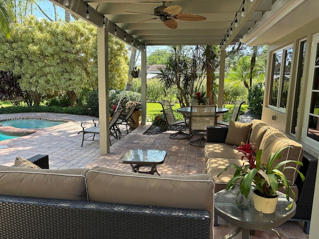 view of patio / terrace with outdoor dining space, an outdoor living space, a ceiling fan, and an outdoor pool