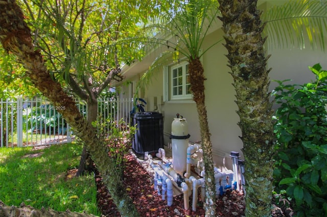 8345 SW 143rd St, Palmetto Bay, FL 33158 - view of side of home with stucco siding and a central air condition unit