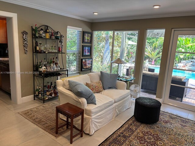 living room with light tile patterned flooring, ornamental molding, and recessed lighting