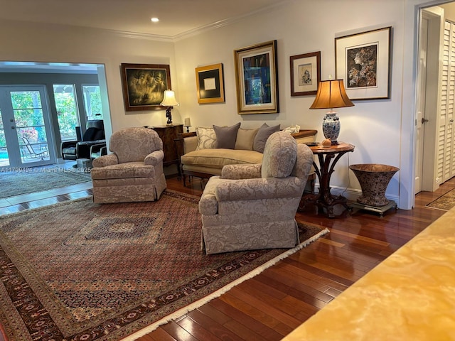 living area with wood-type flooring, ornamental molding, recessed lighting, baseboards, and french doors