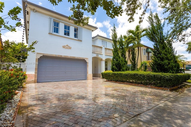 11504 SW 152nd Ct, Miami, FL 33196 - mediterranean / spanish house featuring stucco siding, a garage, a balcony, and decorative driveway