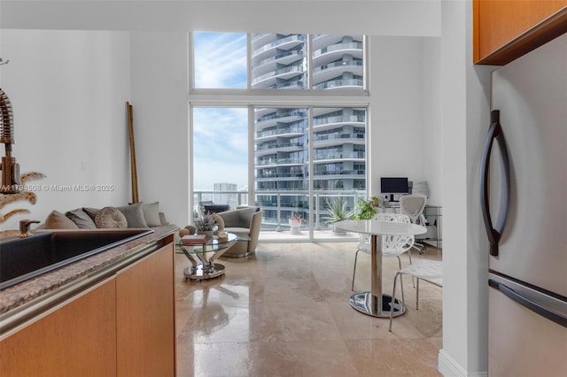 living area featuring an office area and expansive windows