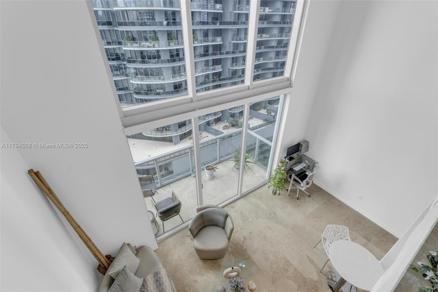 unfurnished room featuring a towering ceiling