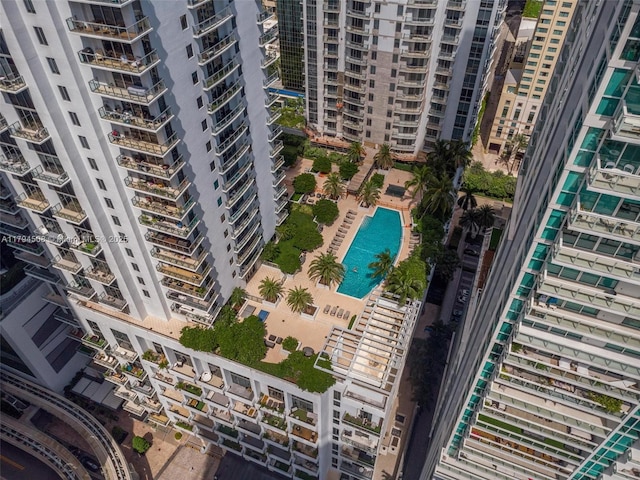 aerial view of a pool and apartment complex