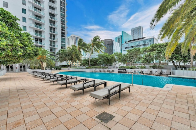 1050 Brickell Ave Unit 2416, Miami, FL 33131 - community pool featuring a view of city and a patio
