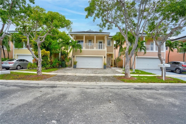 377 NE 34th Ter, Homestead, FL 33033 - view of front of home with a garage, driveway, and stucco siding
