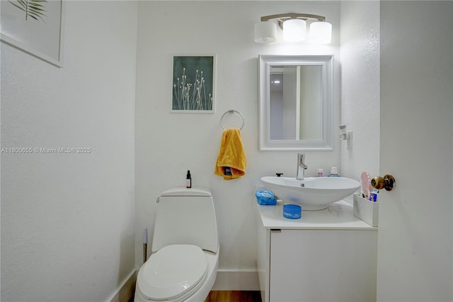 377 NE 34th Ter, Homestead, FL 33033 - bathroom featuring vanity, toilet, and baseboards