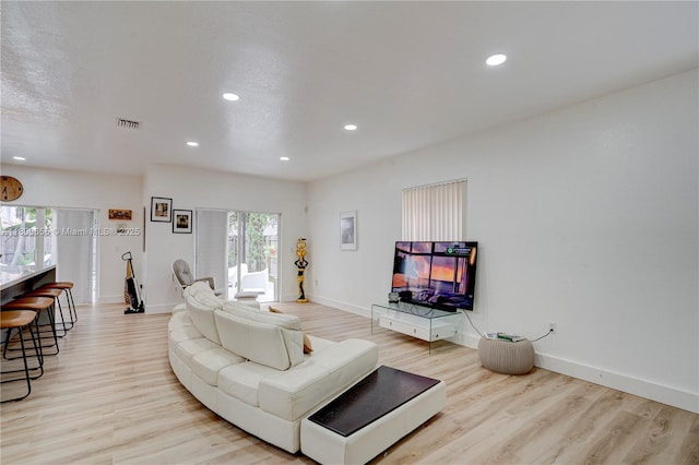 377 NE 34th Ter, Homestead, FL 33033 - living room with light wood-type flooring, recessed lighting, and baseboards