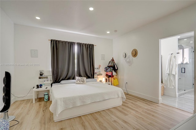 377 NE 34th Ter, Homestead, FL 33033 - bedroom featuring recessed lighting, light wood finished floors, baseboards, and connected bathroom